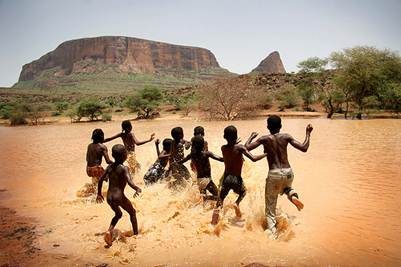 Children playing in the water outside of Hombori, Mali